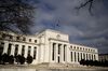 A U.S. flag flies on top of the Marriner S. Eccles Federal Reserve building in Washington, D.C., U.S.