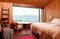 The simple decoration of the hotel’s warm and welcoming rooms ensures minimal distraction from the views offered by their large pictures windows.