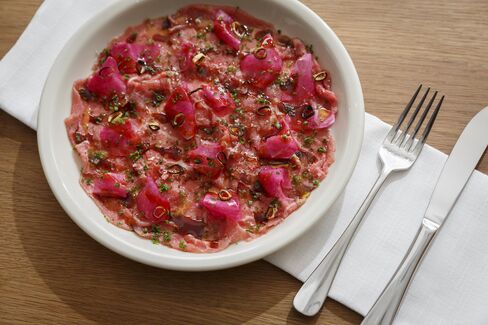 The beef crudo, carved from aged eye-of-round, derives additional color from watermelon radishes.