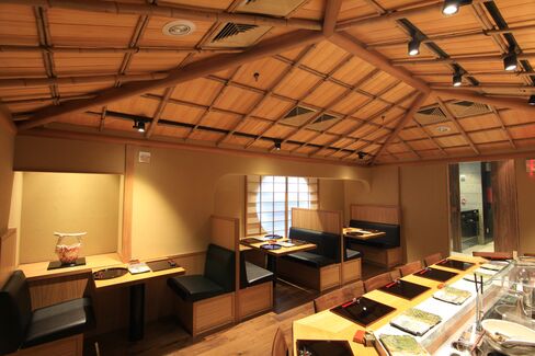The main dining room at Tempura Matsui includes counter seating and a few booths.