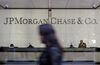 Pedestrians walk past JPMorgan Chase & Co. headquarters in New York, U.S..