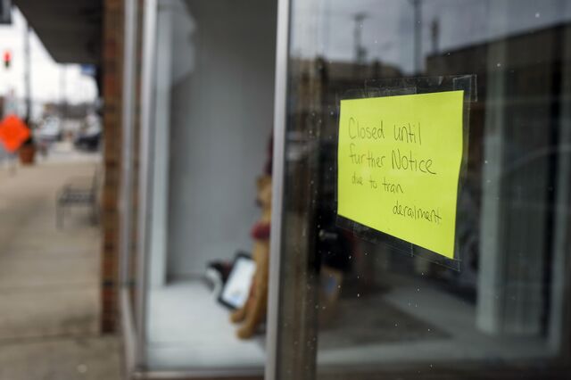 A note on an East Palestine storefront says it is closed due to the train derailment on Feb. 17.