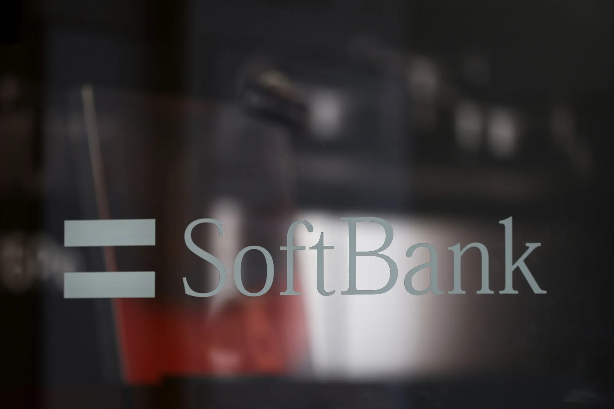 The SoftBank&nbsp;logo displayed on a glass door of the company's store in the Shibuya district of Tokyo, Japan.