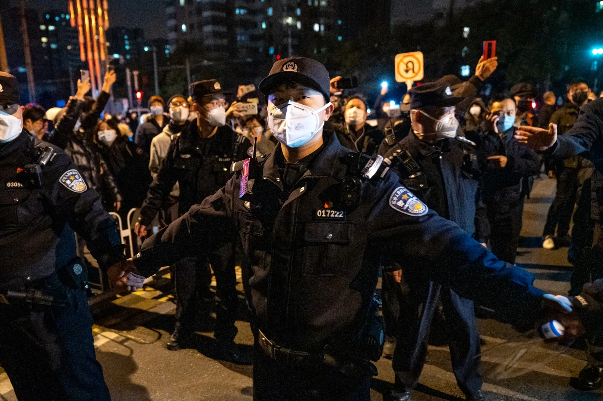 Police officers stand guard in Beijing.