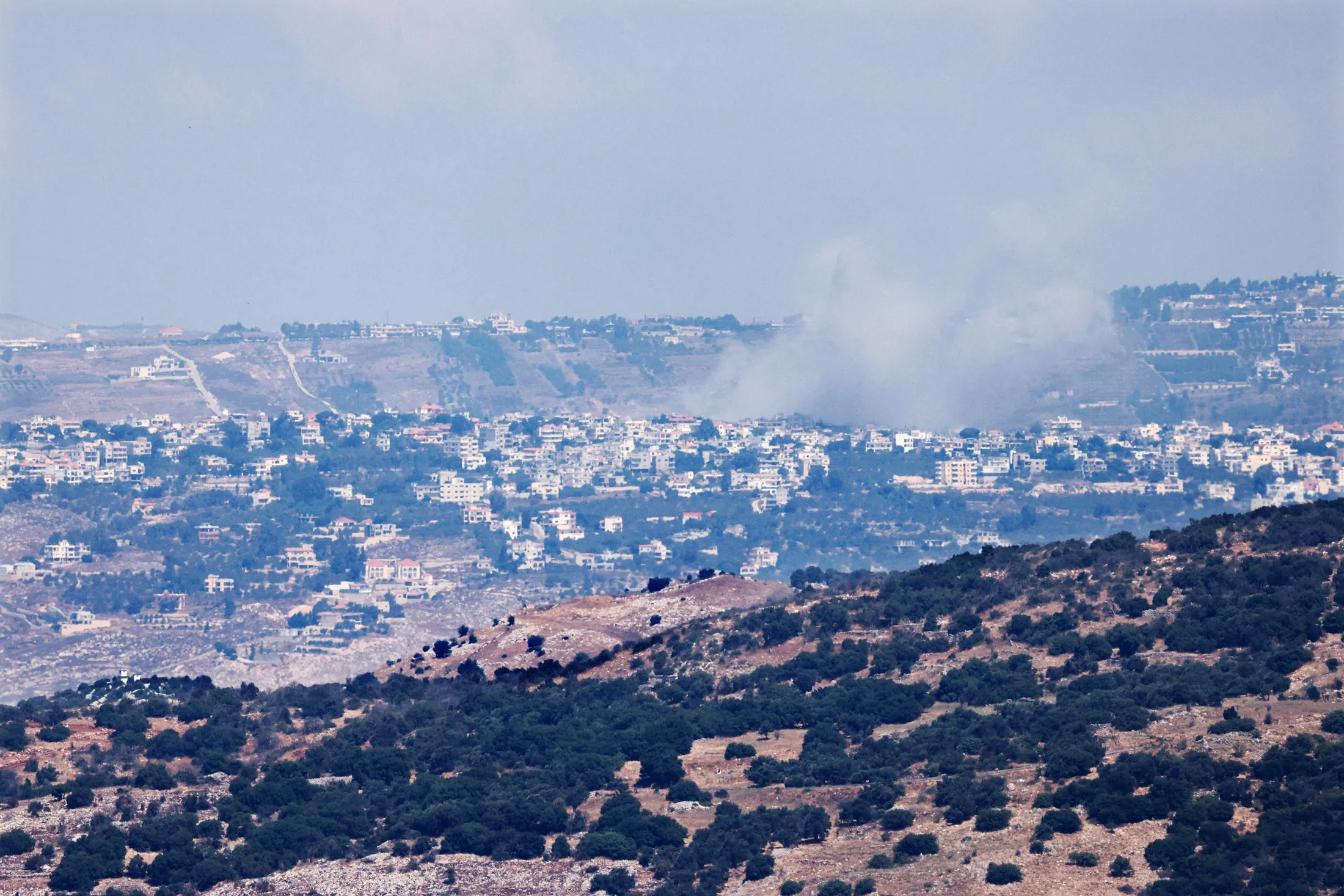 Smoke rises at the village of Khiam, near the Lebanon-Israel border on Aug. 6.