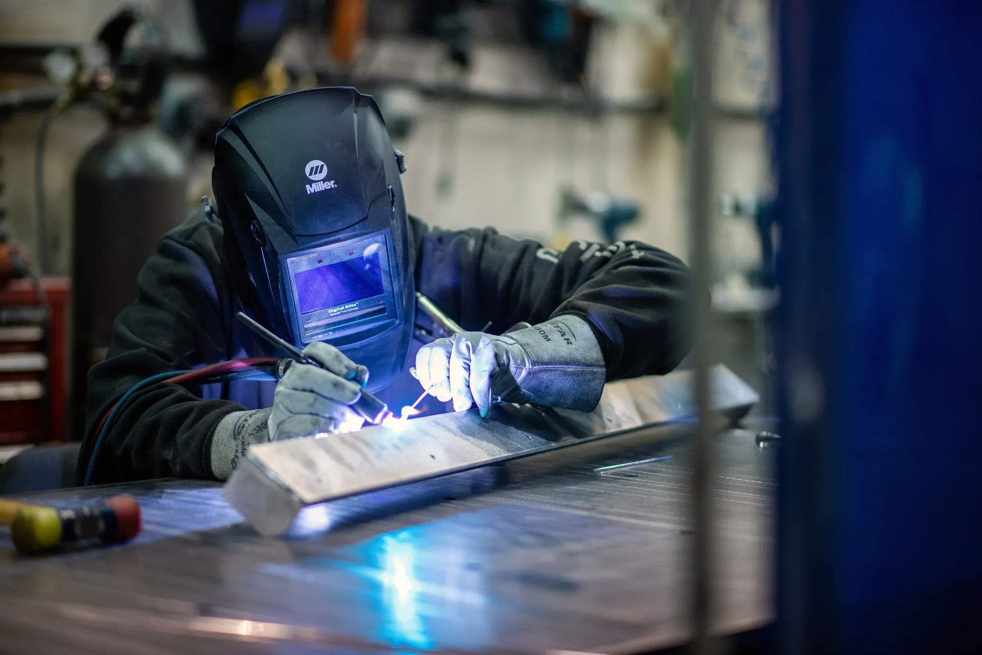 A welder works at a metal shop in Langford, British Columbia on Feb. 10.