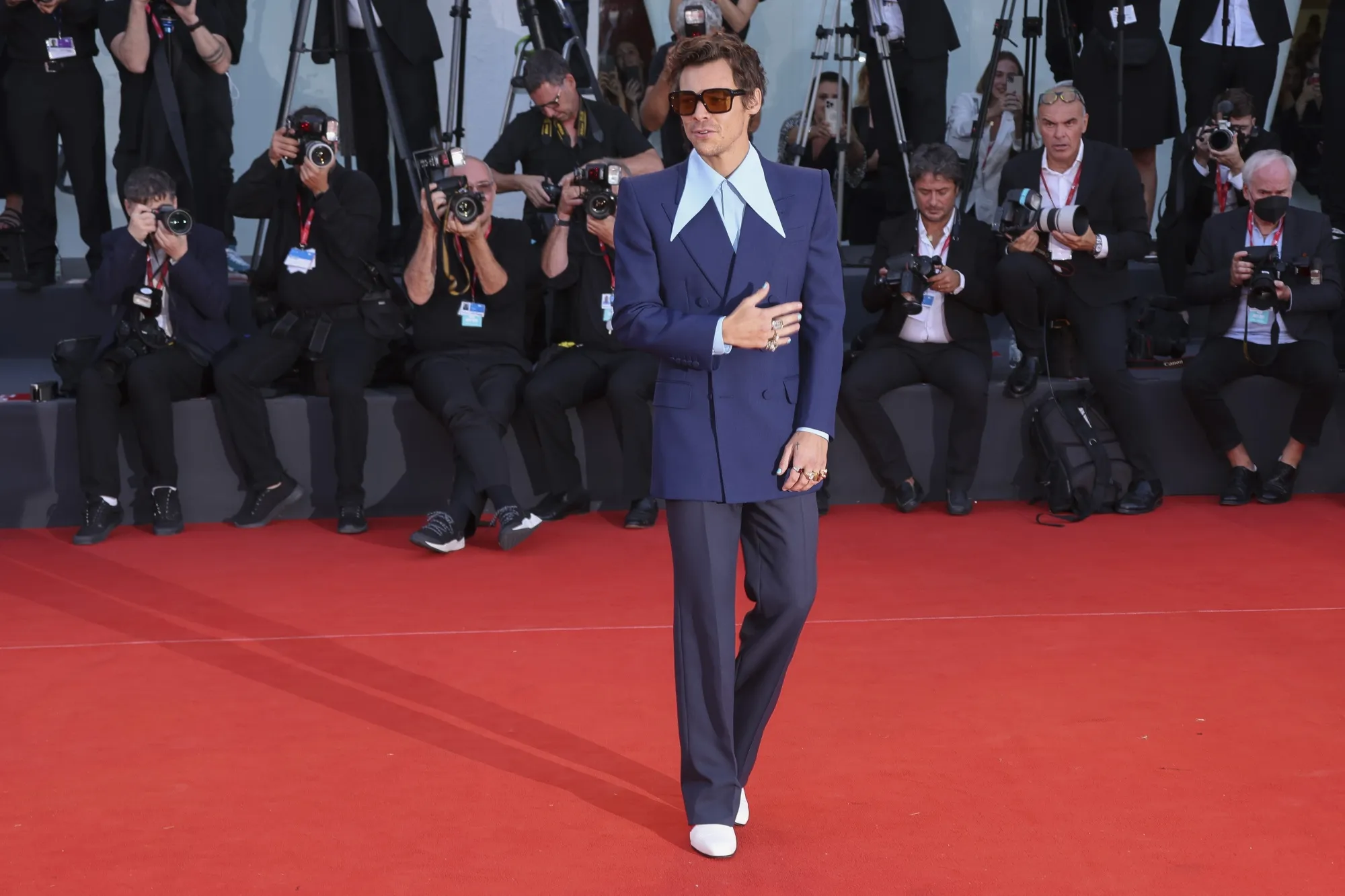Harry Styles poses for photographers upon arrival at the premiere of the film 'Don't Worry Darling' during the 79th edition of the Venice Film Festival in Venice, Italy, Monday, Sept. 5, 2022. (Photo by Joel C Ryan/Invision/AP)