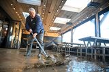 Workers clear up at a cafe following Storm Ciaran in West Bay, Dorset, UK, on Nov. 3.