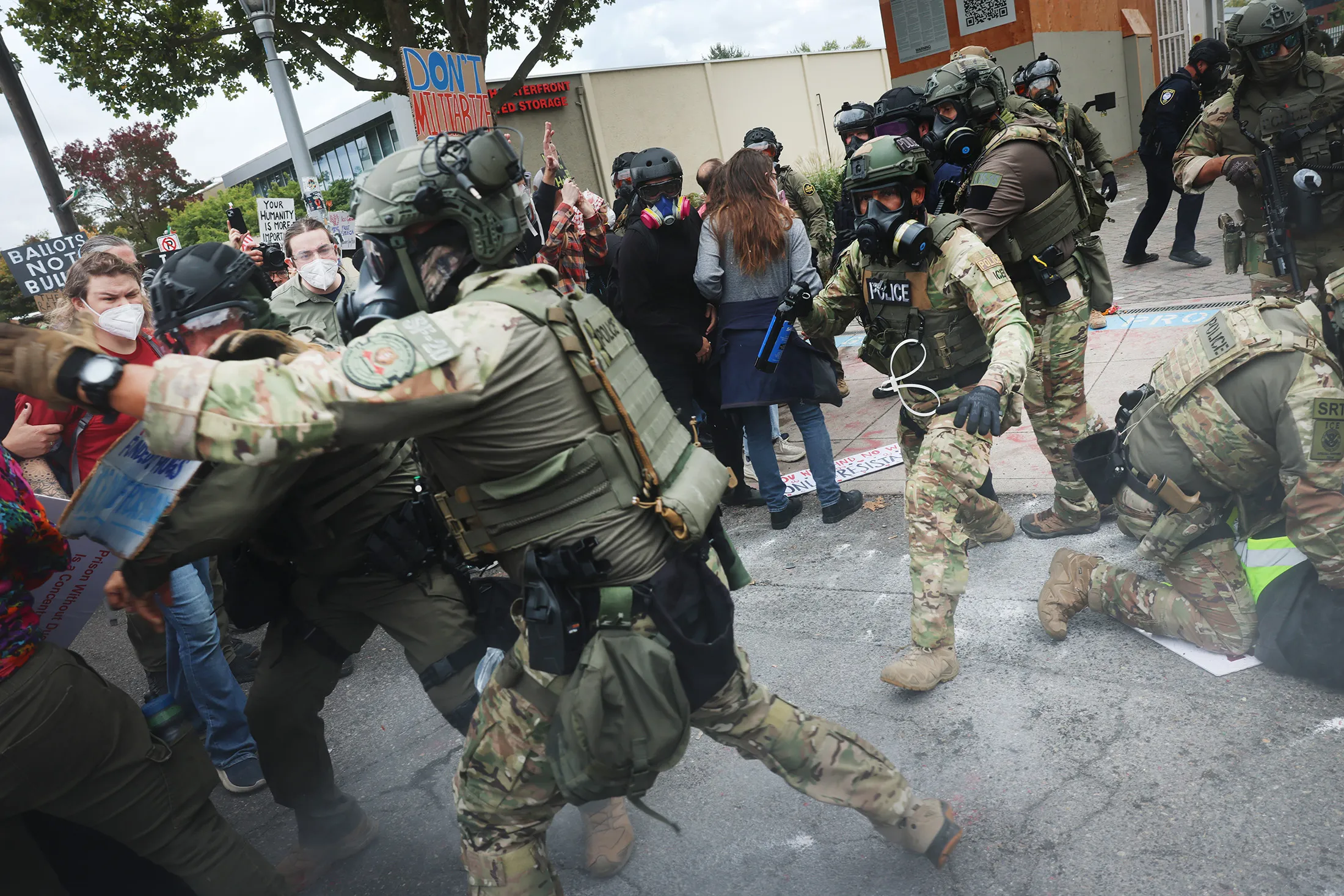 Federal law enforcement officers clash with protesters outside an ICE facility in Portland, Oregon, on Oct. 4.