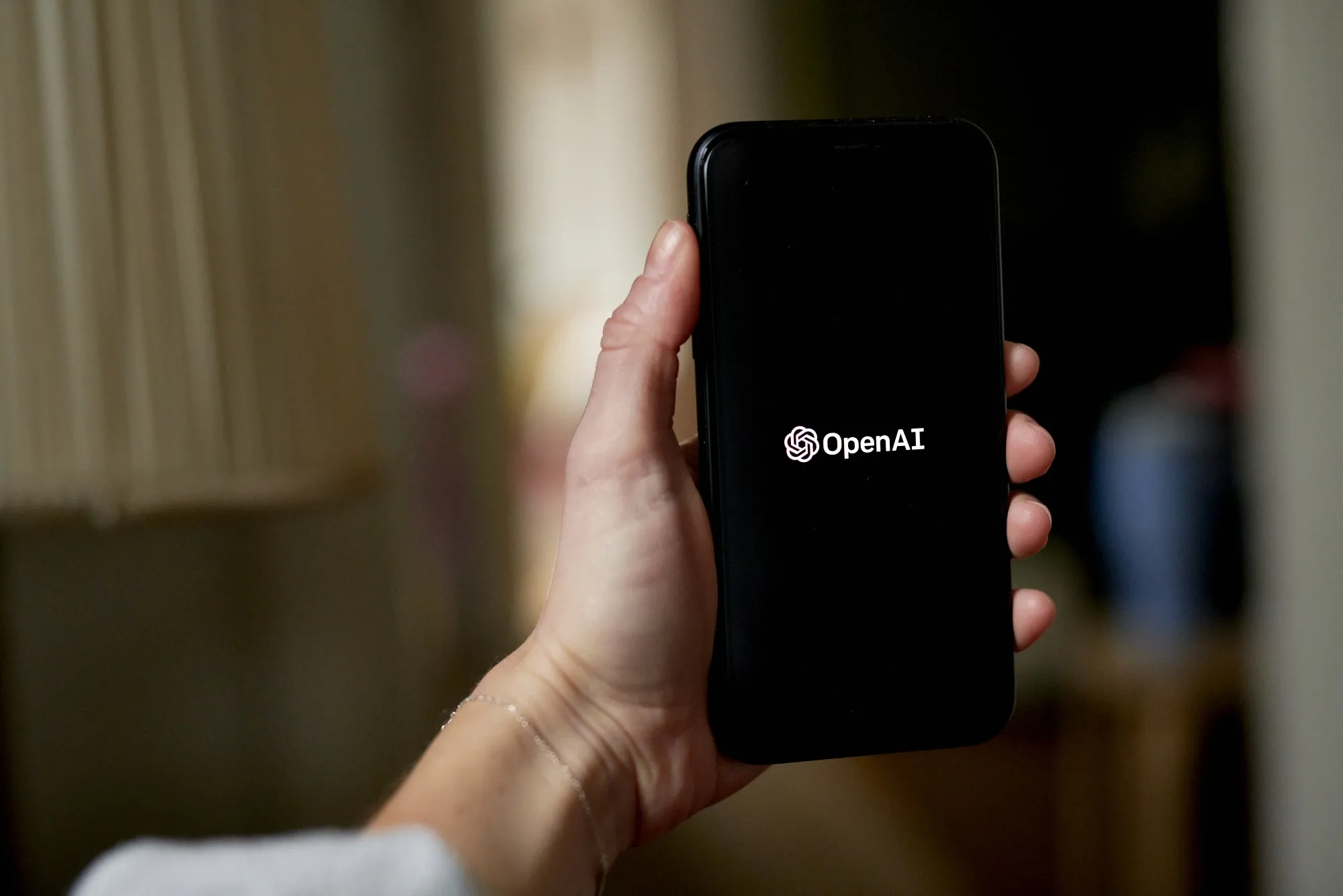 The OpenAI logo on a smartphone.
