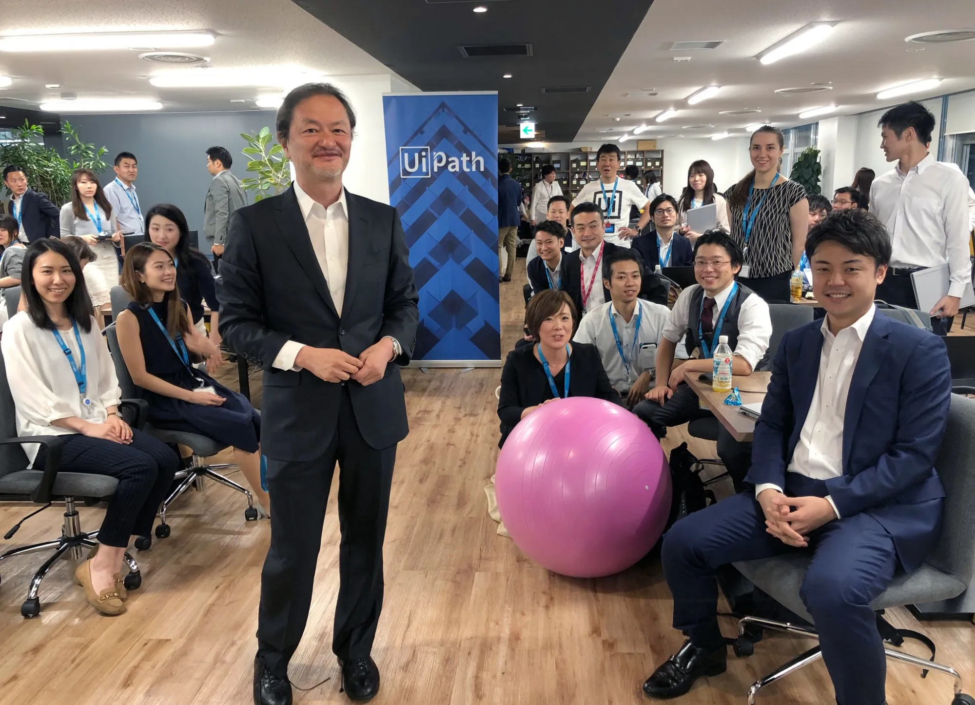 Koichi Hasegawa with company employees in Tokyo.