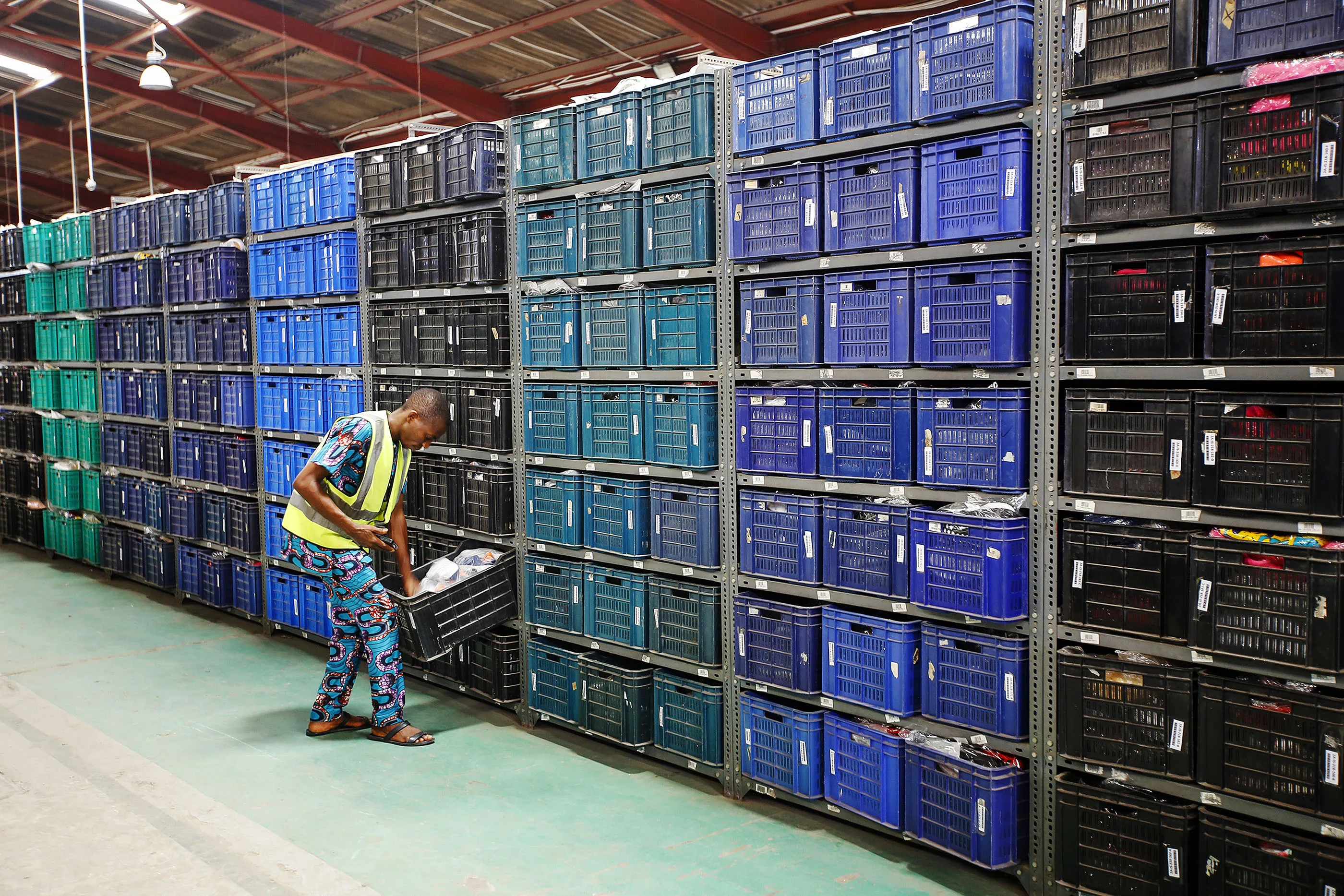 A worker scans inventory inside a Jumia Technologies AG distribution warehouse in Lagos, Nigeria.