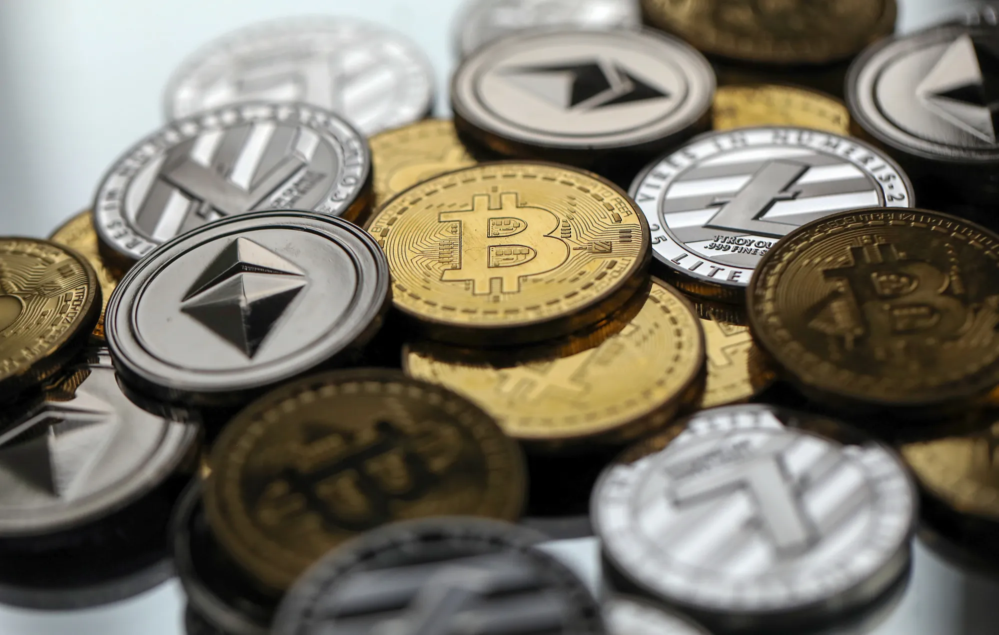 A collection of bitcoin, litecoin and ethereum tokens.
