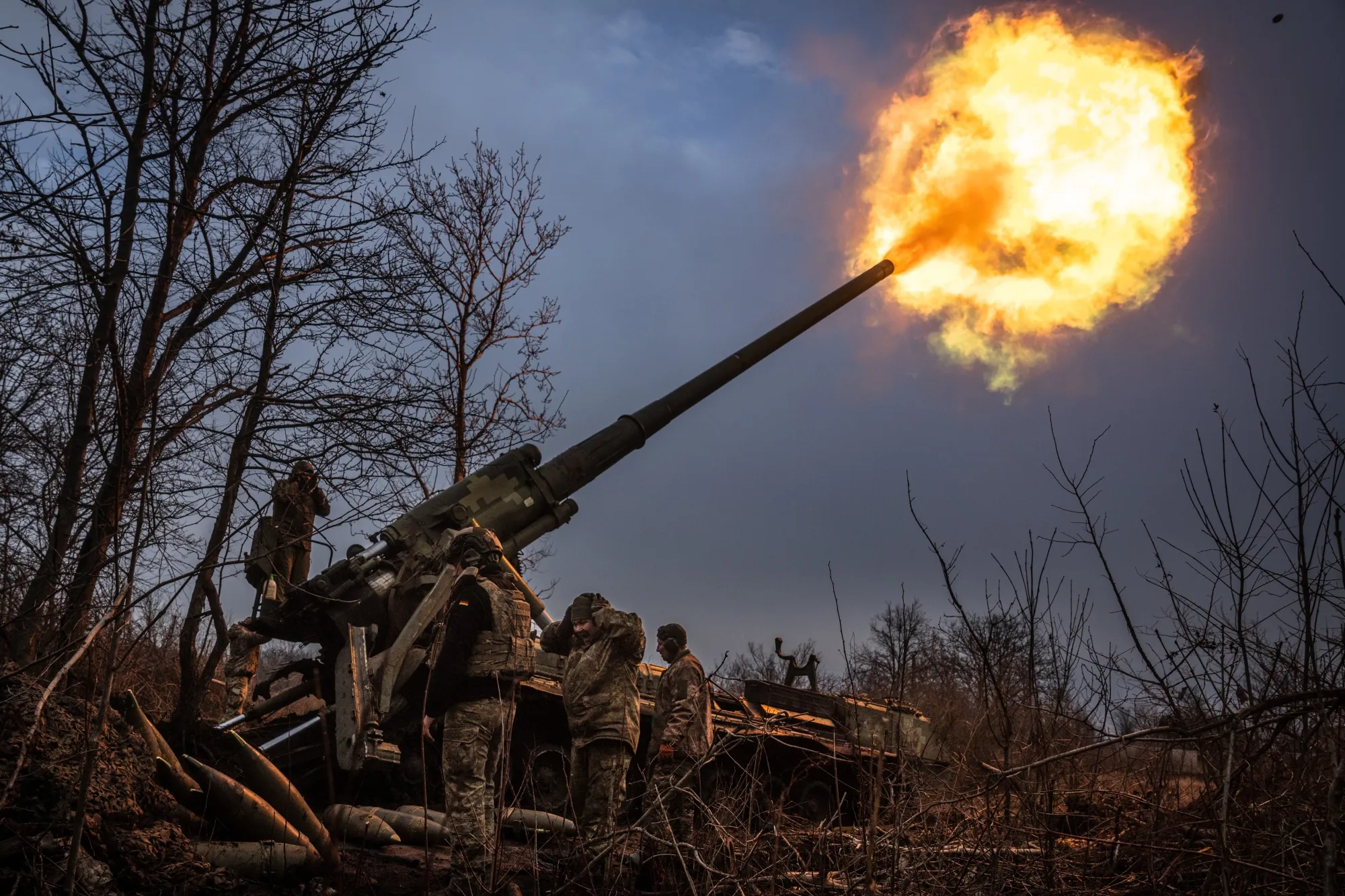 Ukrainian soldiers fire a howitzer in the direction of Chasiv Yar, Ukraine, on Jan. 27.