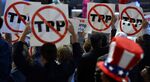 Delegates show their opposition to the Trans-Pacific Partnership agreement during the Democratic National Convention on July 25.
