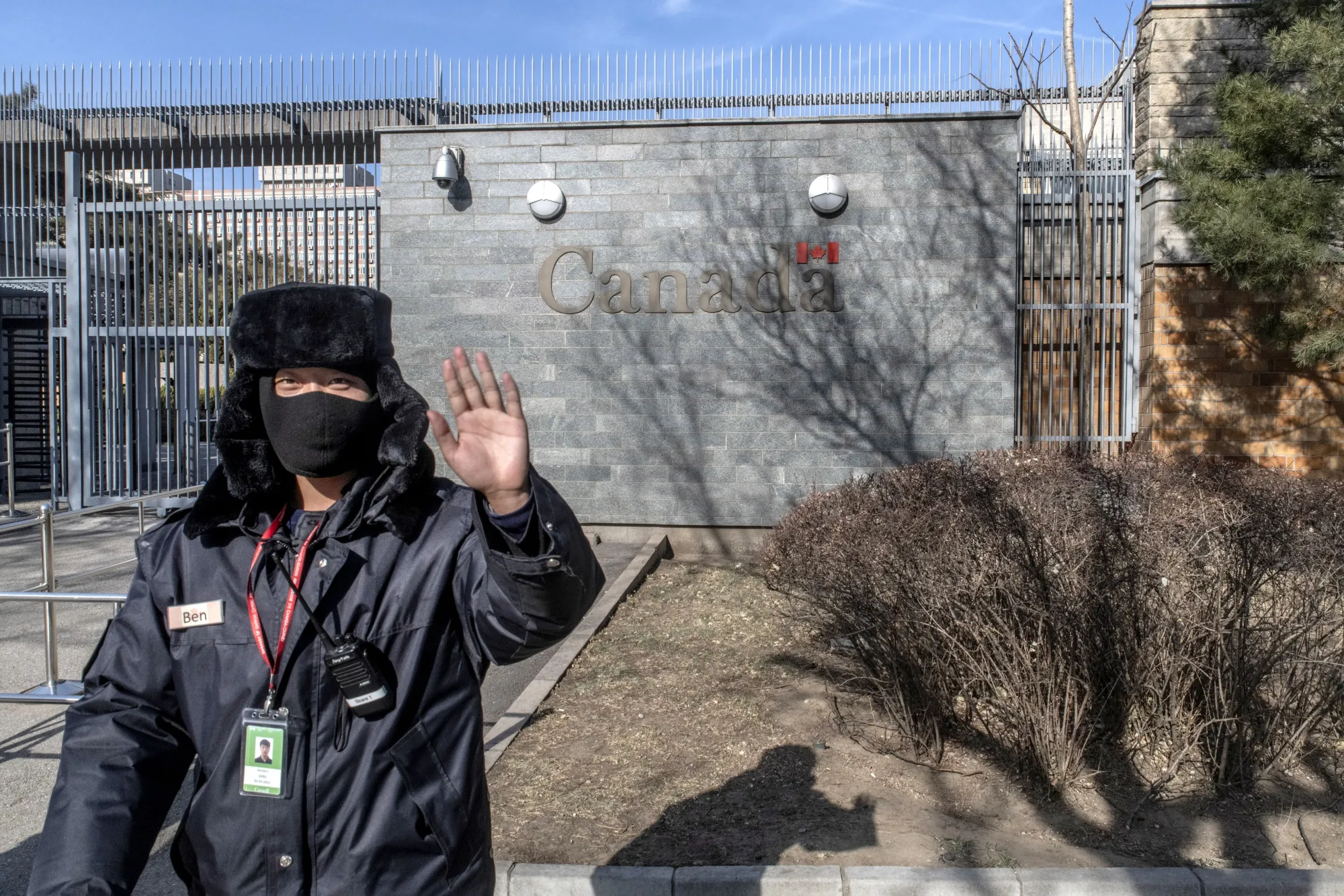 A security officer stands guard outside the Canadian embassy in Beijing.