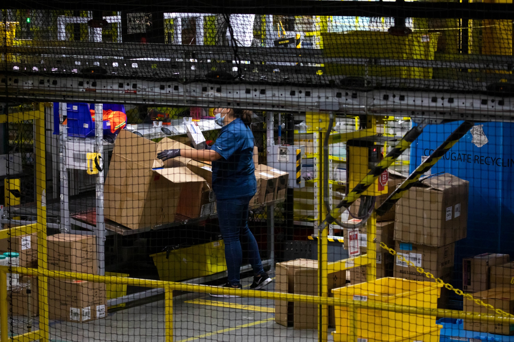 A worker sorts merchandise at an Amazon fulfillment center in Robbinsville, New Jersey.