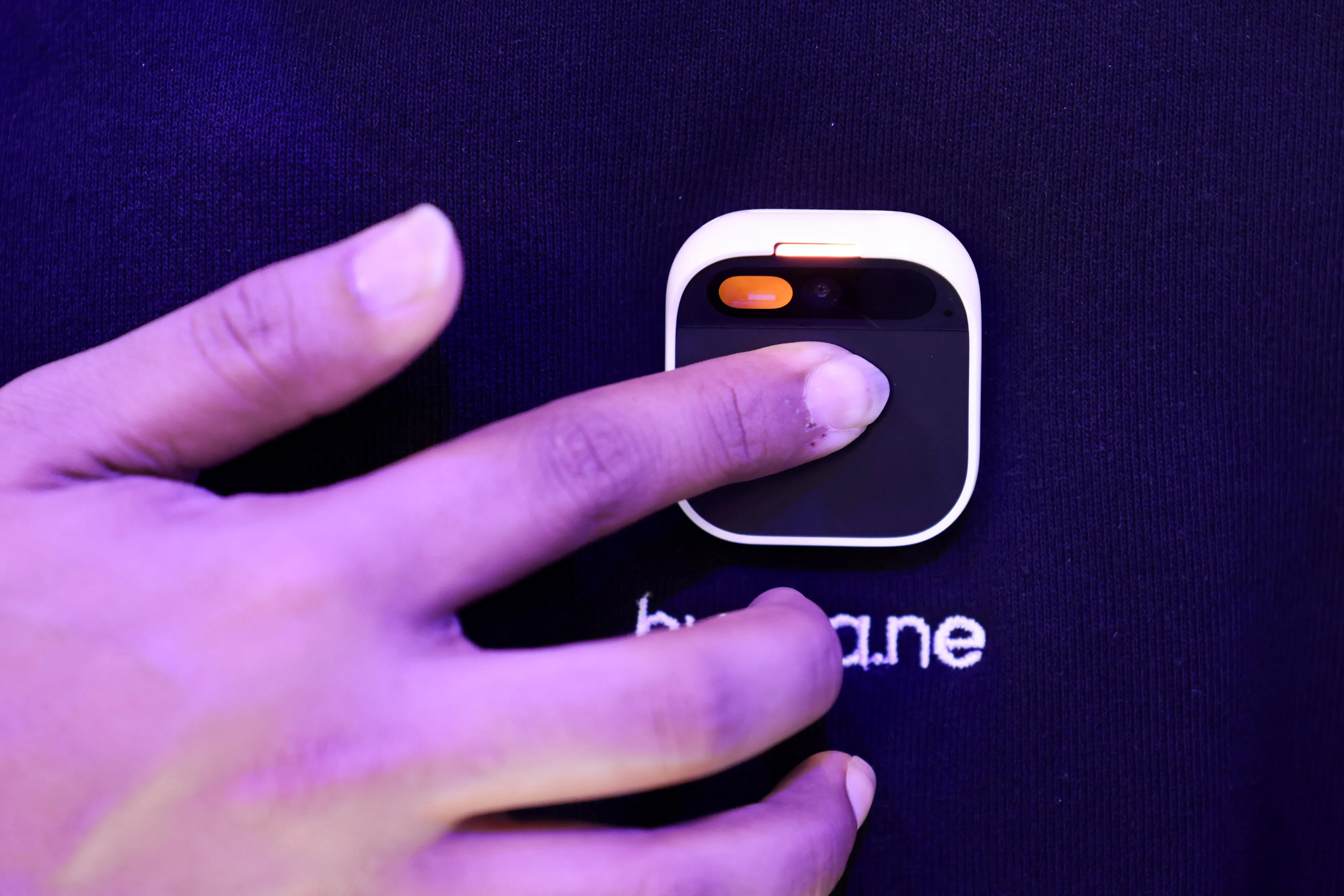 An employee demonstrates a wearable Humane Inc. AI pin.