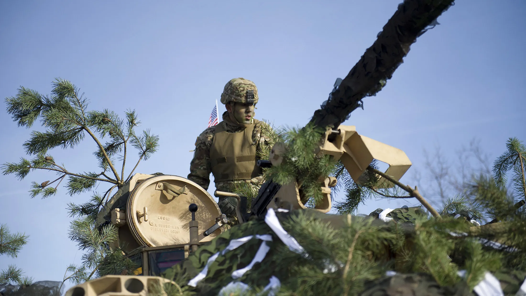 A US soldier is pictured during a welcome of the US Armys 3rd Armored Brigade Combat Team, 4th Infantry Division for the inauguration of a bilateral military training of US and Polish Forces in support of the Atlantic Resolve operation in Zagan, Poland on January 30, 2017. US troops are being deployed in Poland under Operation Atlantic Resolve. Armoured brigade numbering over 3.500 soldiers and 2.700 vehicles and pieces of equipment will conduct bilateral trainings at Polish military bases in Zagan, Boleslawiec, Swietoszow and Skwierzyna. / AFP / NATALIA DOBRYSZYCKA (Photo credit should read NATALIA DOBRYSZYCKA/AFP/Getty Images)
