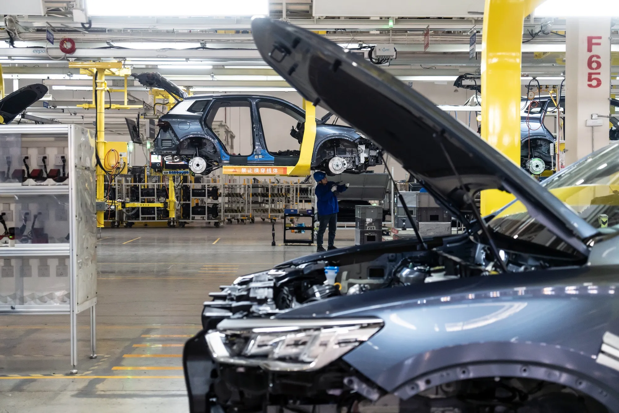 A worker on the assembly line for electric vehicles at the BYD factory in Zhengzhou, China.