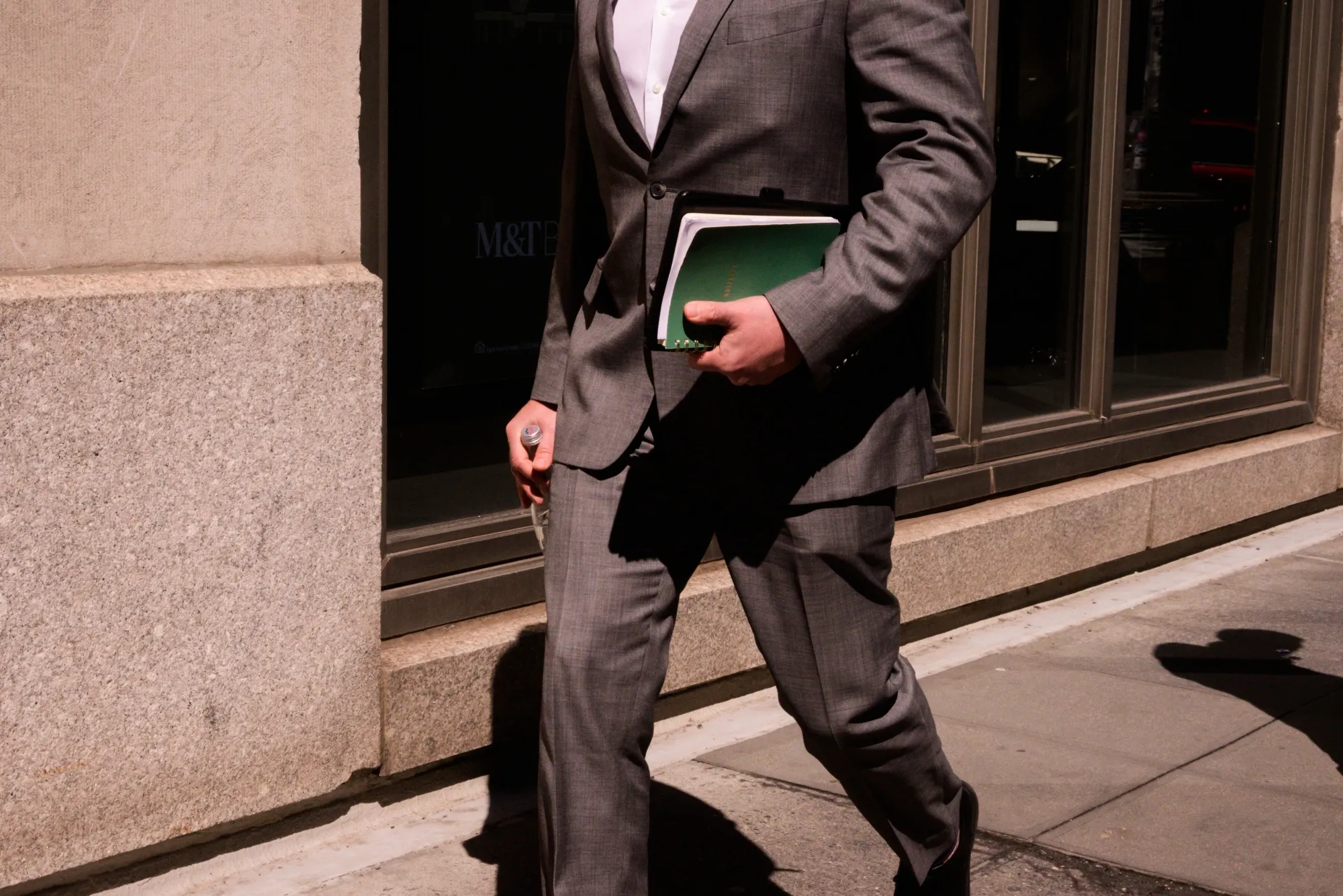 A pedestrian on Park Avenue in the Plaza District of New York.