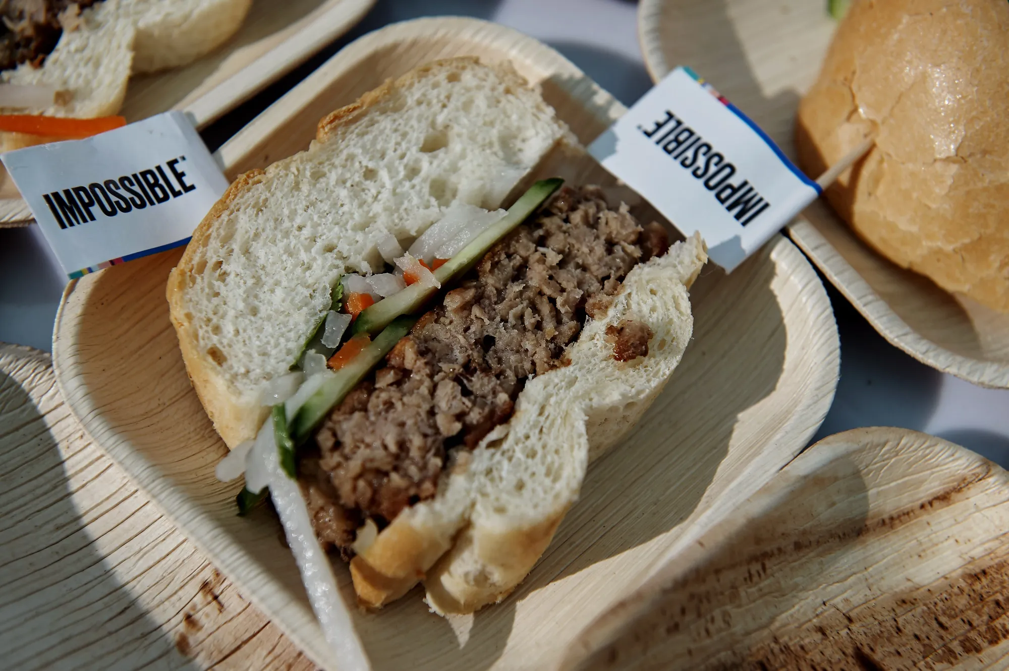 A sandwich made with plant-based pork product is served at the Impossible Foods booth during CES 2020 in Las Vegas.