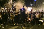Protesters clash with police during an anti government demonstration in Tel Aviv, on March 27.