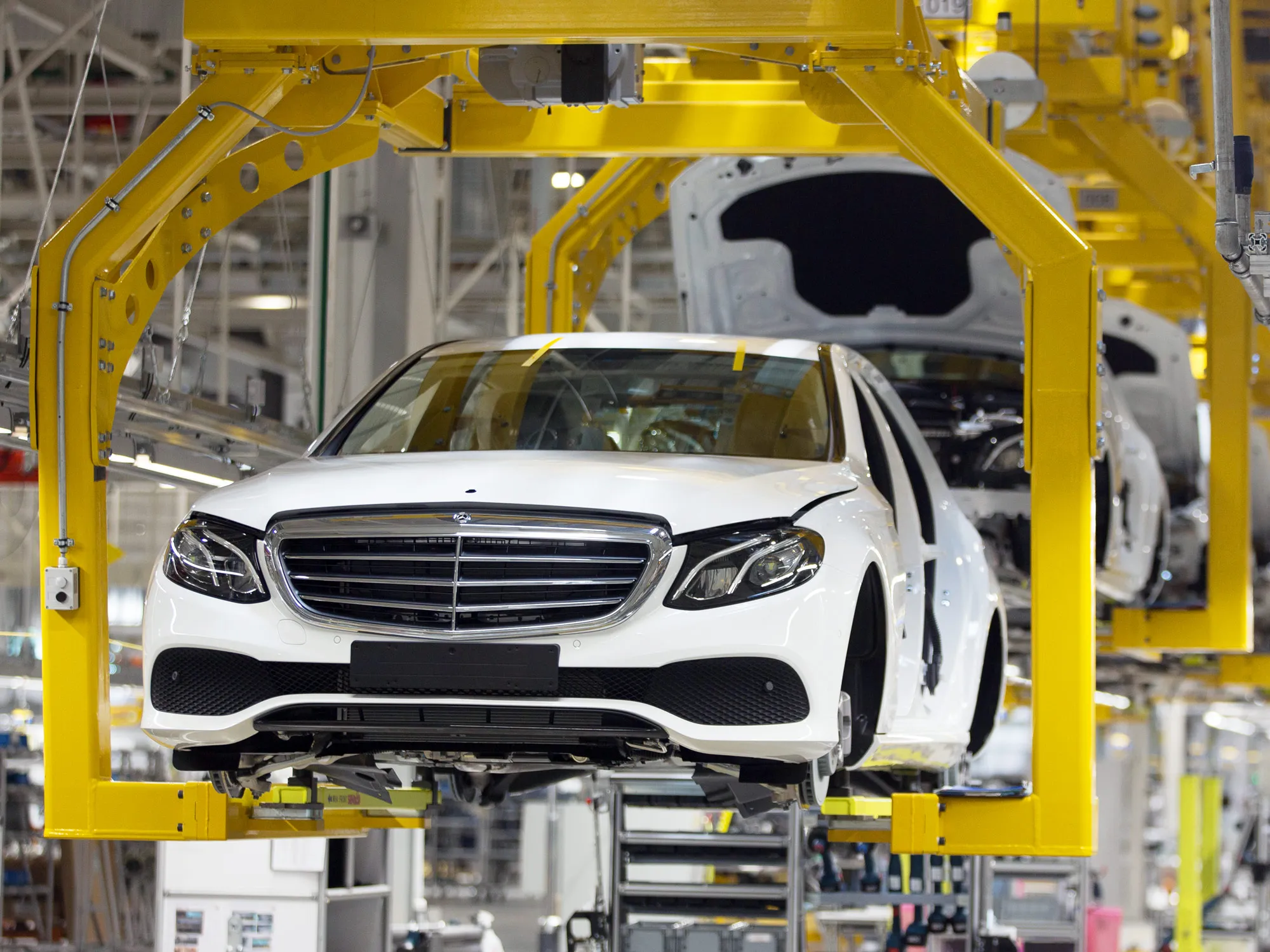 Mercedes-Benz E-Class automobiles move along the production line at the Daimler AG automobile plant in Moscow.