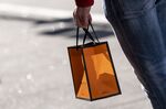 A pedestrian carries a shopping bag in San Francisco, California, U.S., on Thursday, Dec. 30, 2021.