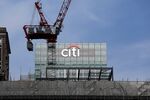 A construction crane stands above scaffolding near the offices of Citigroup Inc. in London.