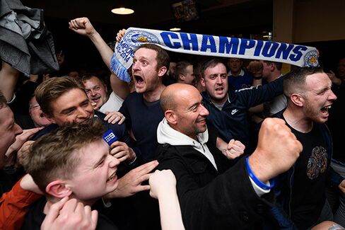 Leicester City fans celebrate on May 2.