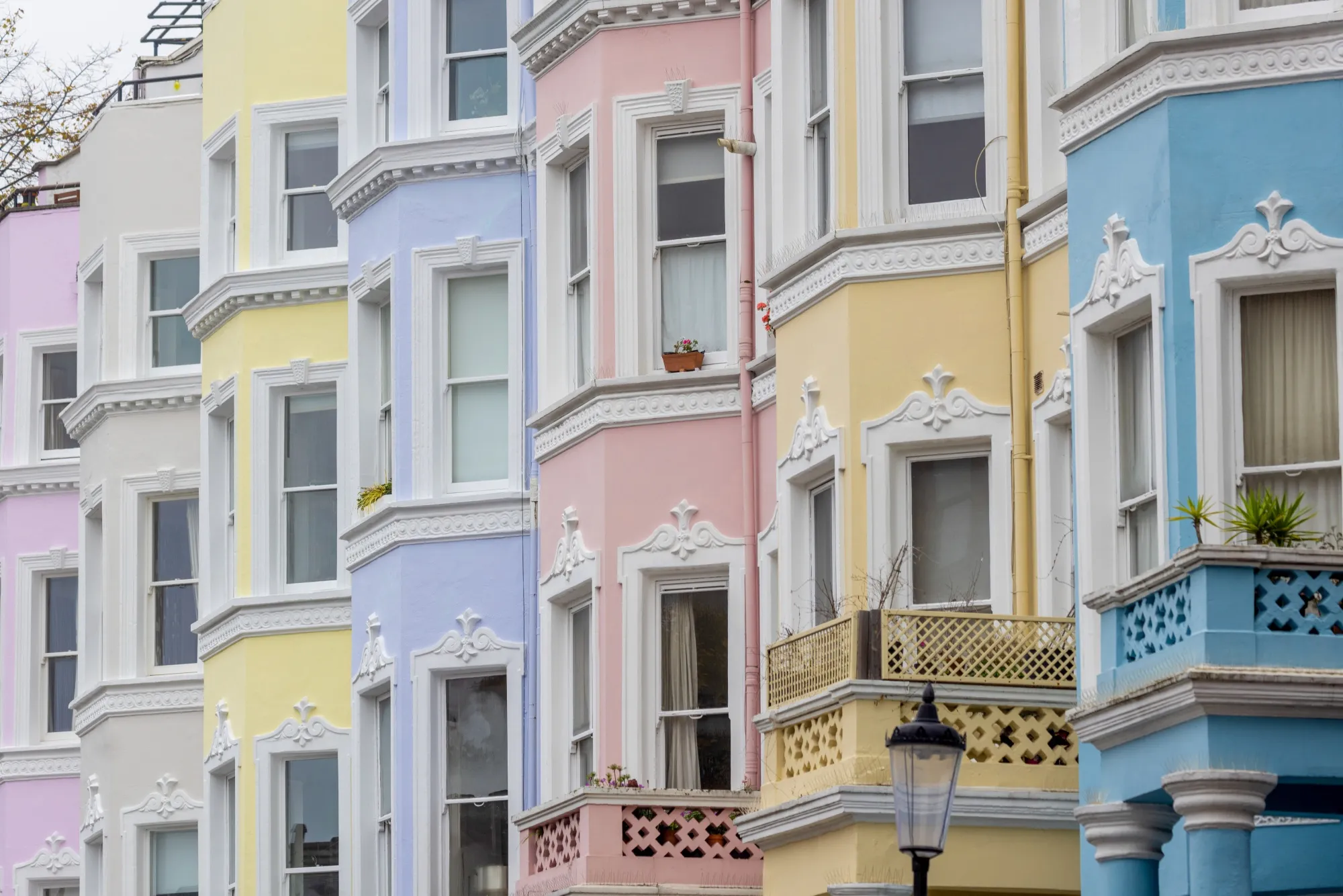 Pastel-coloured residential terraced buildings in the Kensington and Chelsea district of London, UK, on Monday, Nov. 14, 2022.