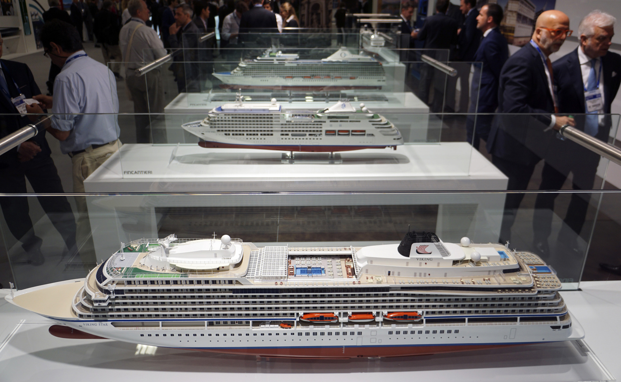 Models of ships sit at the Fincantieri booth at a&nbsp;trade show in Miami in 2015.