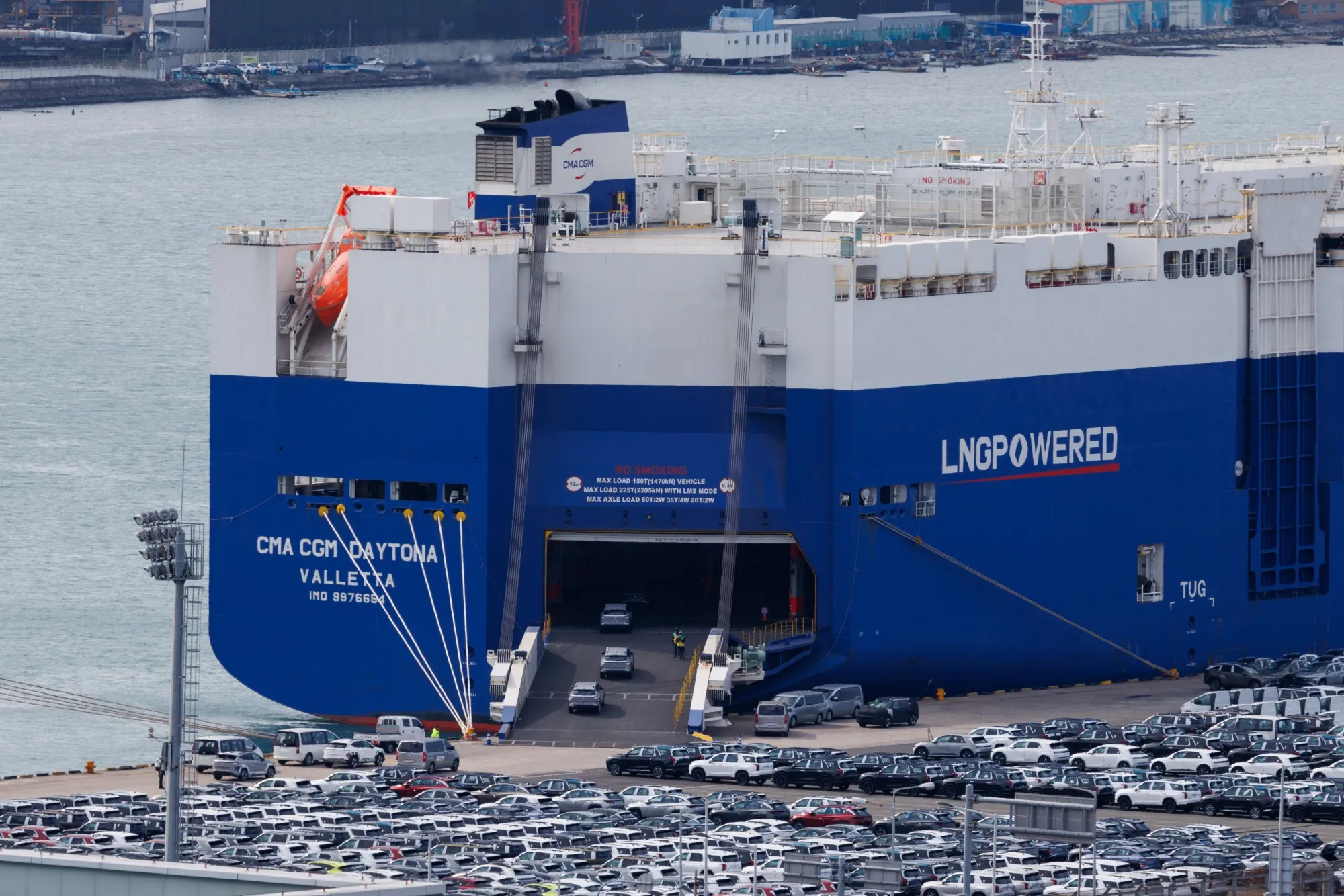 Hyundai Motor vehicles drive into a vehicle carrier cargo ship at a port near the company's Ulsan plant in Ulsan.