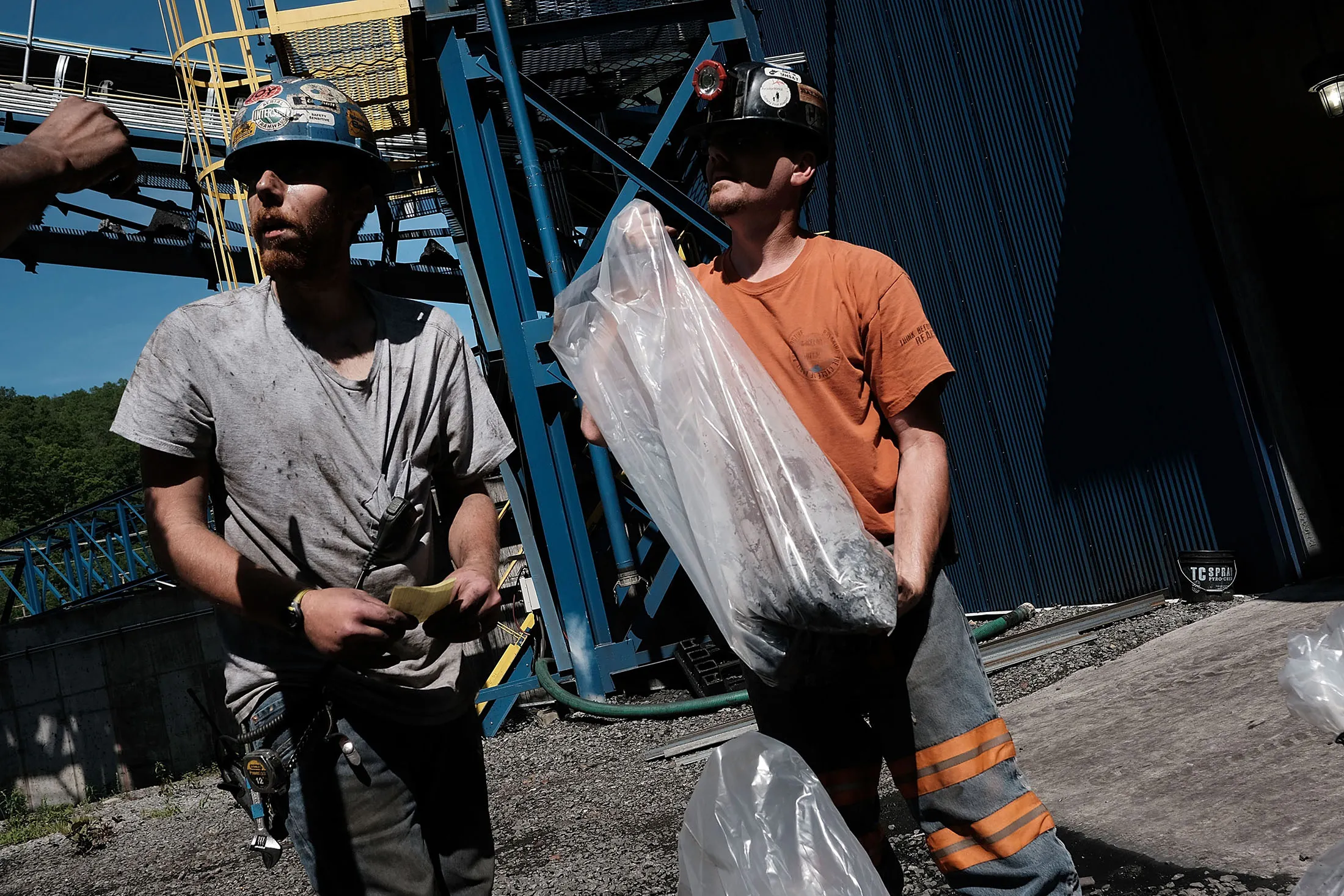 Men take coal samples at a coal prep plant outside the city of Welch, West Virginia, on May 19, 2017.
