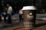 A cup of coffee in an arranged photo outside a Peet's Coffee & Tea store in Washington, DC, US, on Monday, Aug. 25, 2025. Keurig Dr Pepper Inc. agreed to buy JDE Peet's NV for 15.7 billion ($18.4 billion) to bolster its struggling coffee business before kicking off a split of its operations.