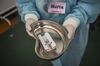 A health worker in Peru prepares a syringe to inoculate a volunteer with the Sinopharm vaccine on Dec. 9.