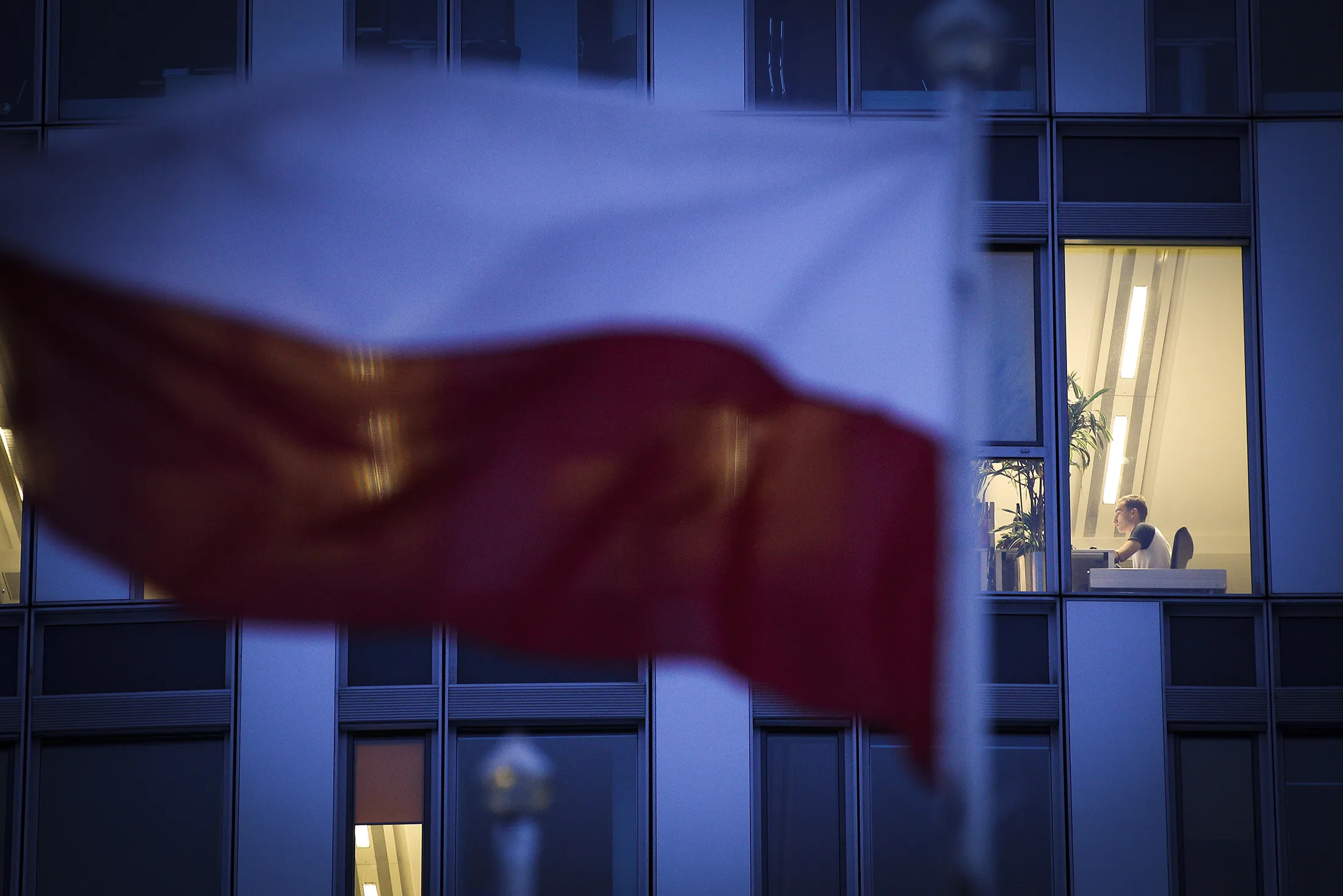 People are seen in the offices of Huawei Poland in Warsaw.