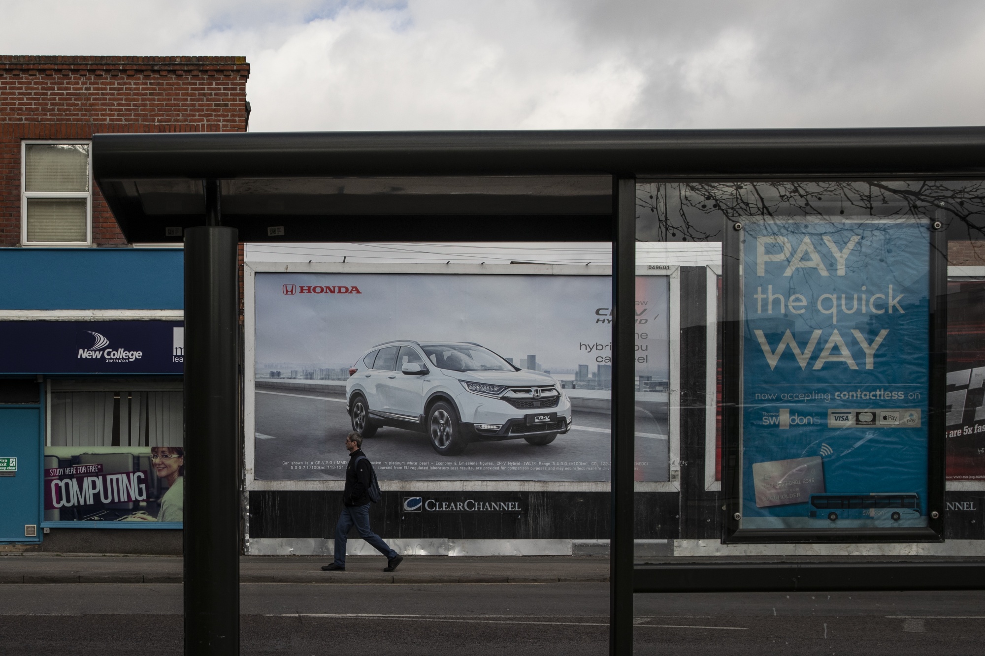 A poster advertising Honda cars in Swindon, England.
