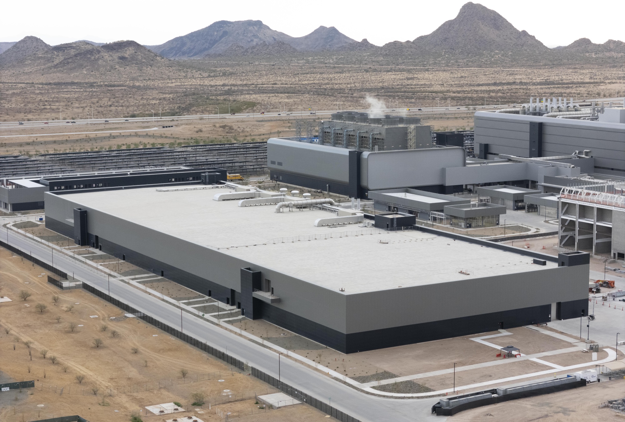 The Taiwan Semiconductor Manufacturing Company (TSMC) fabrication plant in Phoenix, Arizona, US, on Monday, March 3, 2025. Taiwan Semiconductor Manufacturing Co., the world’s top producer of AI chips, plans to invest an additional $100 billion in US plants that will boost its chip output on American soil and support President Donald Trump’s goal of increasing domestic manufacturing.