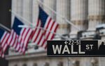 A Wall St sign hangs at the New York Stock Exchange (NYSE) at Wall Street,