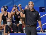 United States head coach Adam Krikorian, right, directs players during a quarterfinal round win over Canada in a women's water polo match at the 2020 Summer Olympics, Aug. 3, 2021, in Tokyo, Japan. Right after the Summer Olympics, Krikorian was done. Worn down by coaching the U.S. women's water polo team through a pandemic, he thought it might be time to try something new. (AP Photo/Mark Humphrey, File)