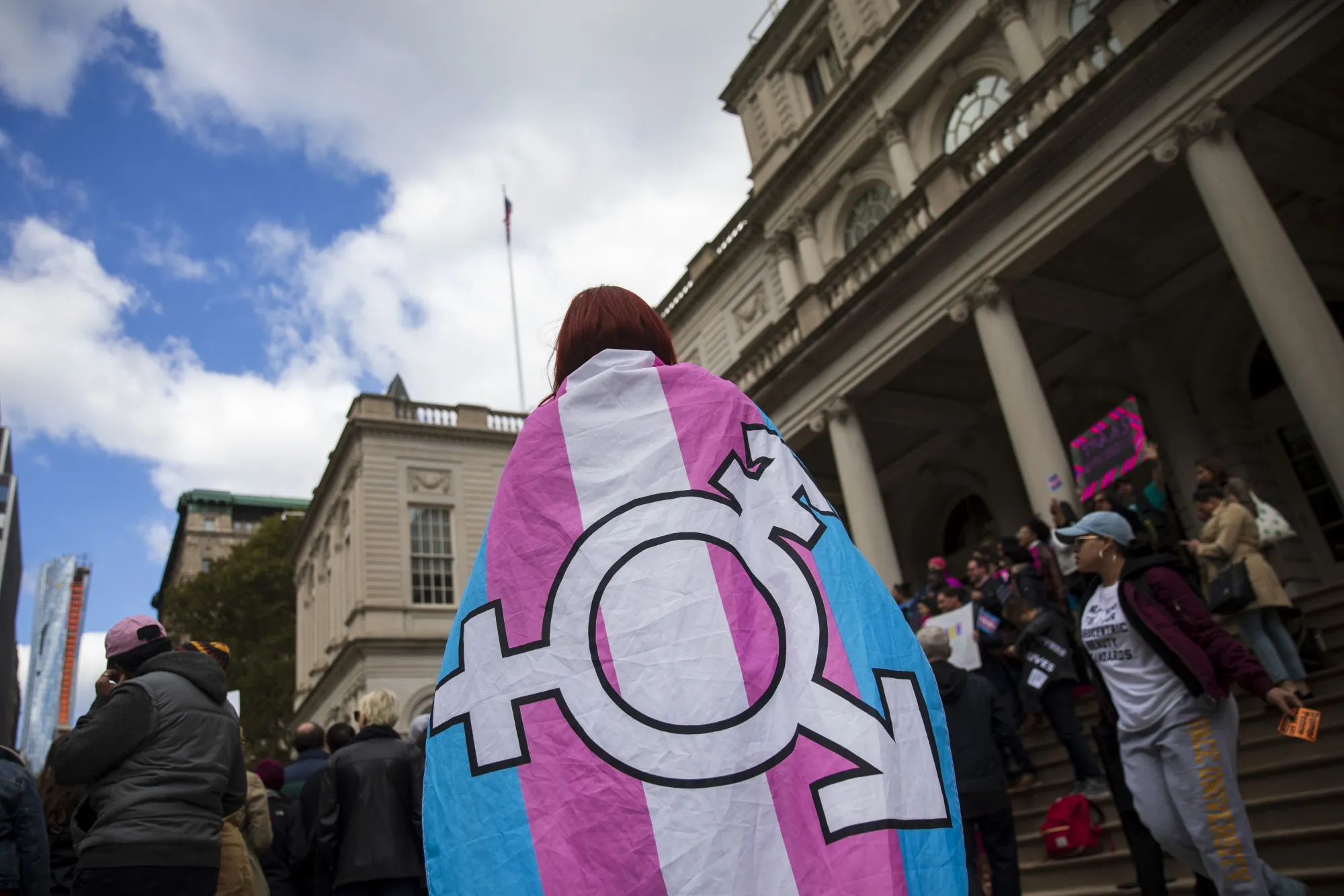 LGBT activists and supporters rally in support of transgender people at&nbsp;New York City Hall.