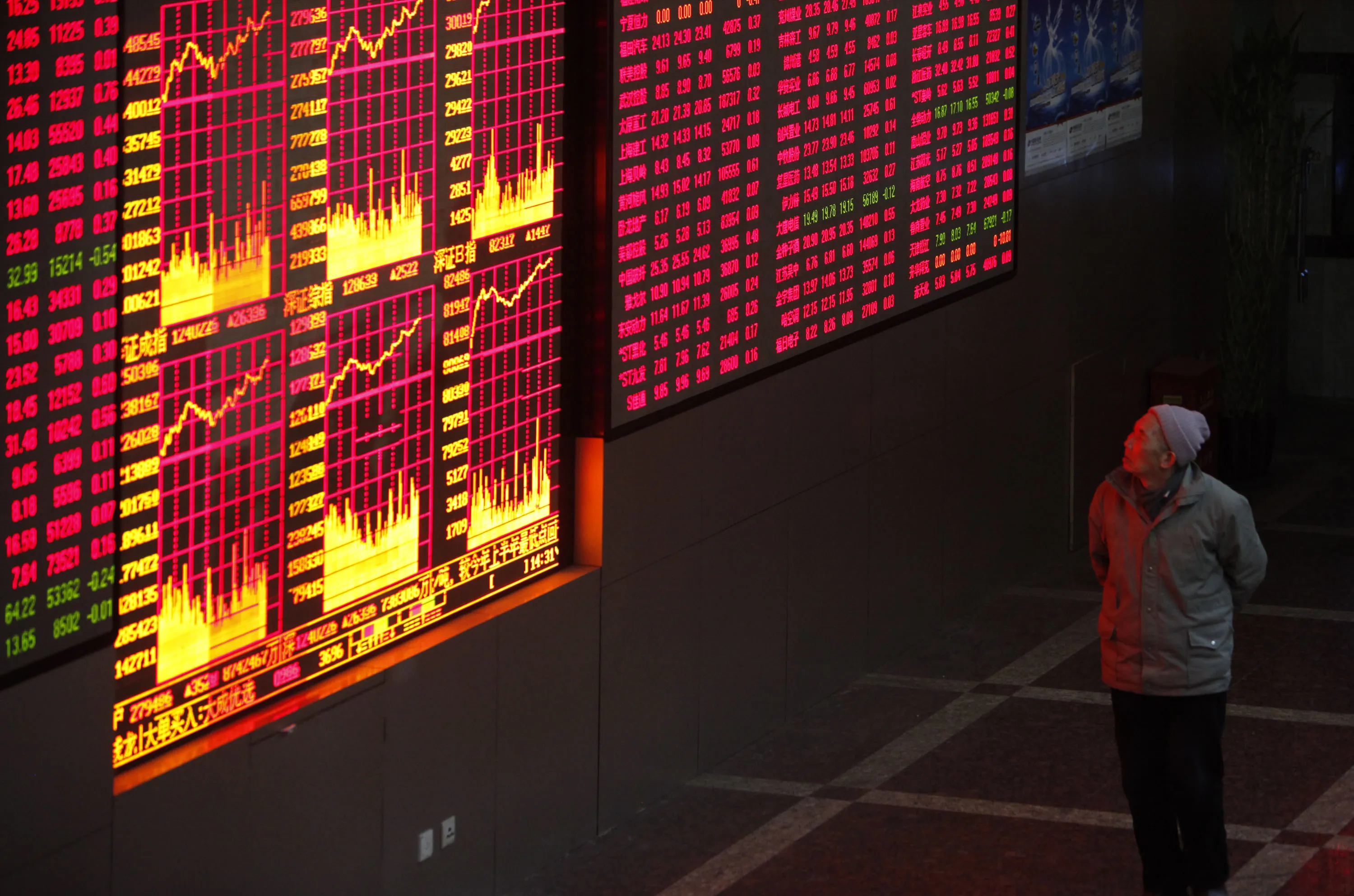An investor monitors stock prices at a securities exchange firm&nbsp;in Shanghai, China.