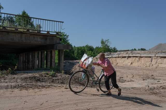 A local resident in front of a destroyed bridge in Chernihiv, Ukraine, on Monday, July 4, 2022. Photographer: Andrew Kravchenko