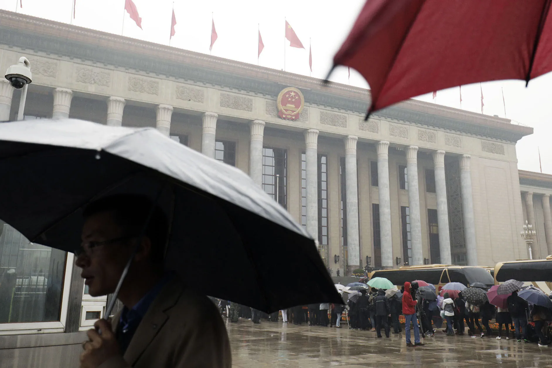 People wait in line outside the Great Hall of the People before the opening of the 19th National Congress of the Communist Party of China in Beijing, China, on Wednesday, Oct. 18, 2017. Chinese President Xi Jinping warned of “severe” challenges Wednesday, as he kicked off a twice-a-decade party meeting that may signal if he will appoint a successor to rule after 2022.
