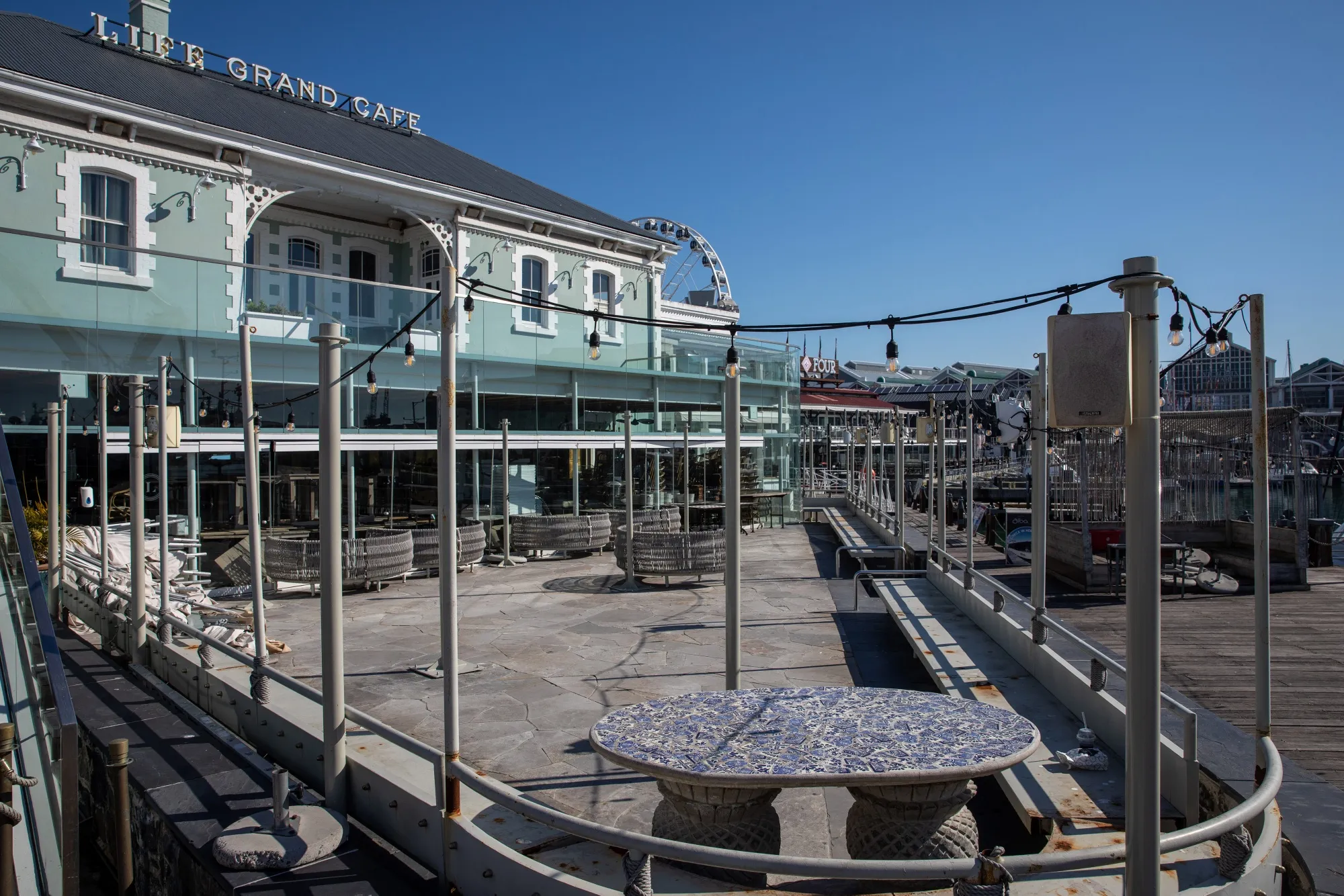 A restaurant stands closed at the Victoria & Alfred Waterfront retail district in Cape Town, South Africa, on July 23, 2020.