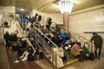 Residents shelter in a subway station during s rocket attack in Kyiv, Ukraine, on Dec. 31