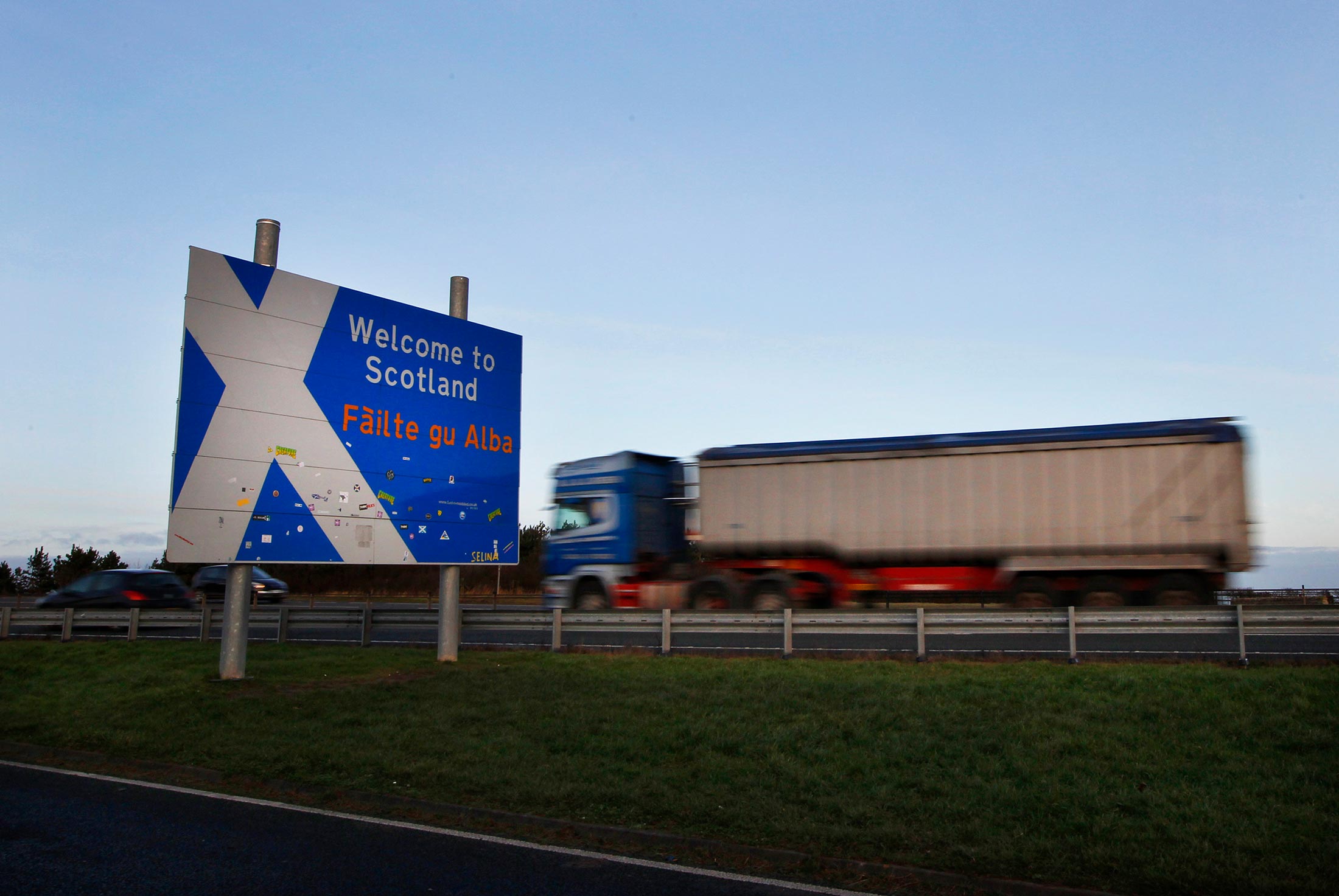 A lorry passes a “Welcome to Scotland” sign at the border near Berwick-upon-Tweed in northern England in January 2012.