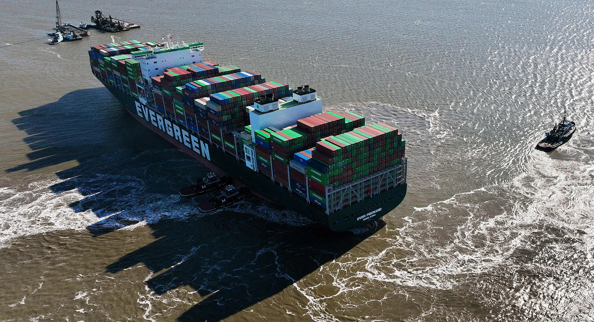 Tugboats pull on the Ever Forward container ship in Pasadena, Maryland, trying to free the cargo ship as it sits in the Chesapeake Bay after it ran aground near Baltimore.